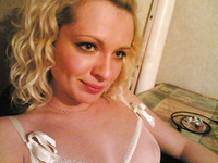 Playful blonde takes naughty pictures