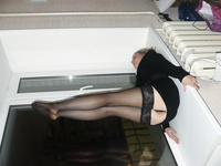 Playful blonde takes naughty pictures