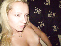 Playful blonde takes naughty pictures